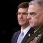 General Mark Milley (R), chairman of the US Joint Chiefs of Staff, is seen  with Defense Secretary Mark Esper at an October 28, 2019 Pentagon news briefing on the death of IS leader Abu Bakr al-Baghdadi; Milley says 500 US troops will remain in Syria