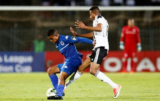 A file photo of SuperSport United midfielder Sipho Mbule (L), who scored the only goal in a South African Premiership match against Bidvest Wits in Johannesburg Friday