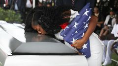 Myeshia Johnson kisses the casket of her husband US Army Sgt. LaDavid Johnson, who was killed in the October 4, 2017 ambush in Niger