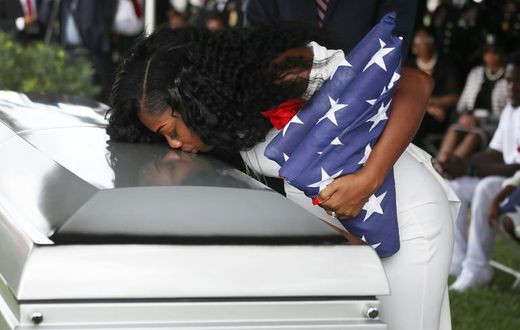 Myeshia Johnson kisses the casket of her husband US Army Sgt. LaDavid Johnson, who was killed in the October 4, 2017 ambush in Niger