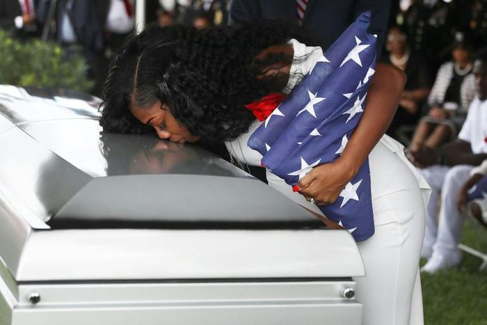 Myeshia Johnson kisses the casket of her husband US Army Sgt. LaDavid Johnson, who was killed in the October 4, 2017 ambush in Niger