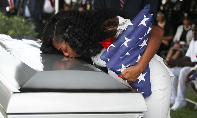 Myeshia Johnson kisses the casket of her husband US Army Sgt. LaDavid Johnson, who was killed in the October 4, 2017 ambush in Niger