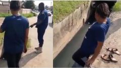 Police officer forces beautiful lady to enter dirty gutter to pick ‘pure water’ sachet