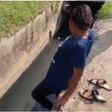 Police officer forces beautiful lady to enter dirty gutter to pick ‘pure water’ sachet