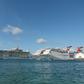 The Royal Caribbean ship Allure of the Seas (L) and Carnival Cruise ships Liberty and Elation are seen in Nassau, Bahamas in April 2019
