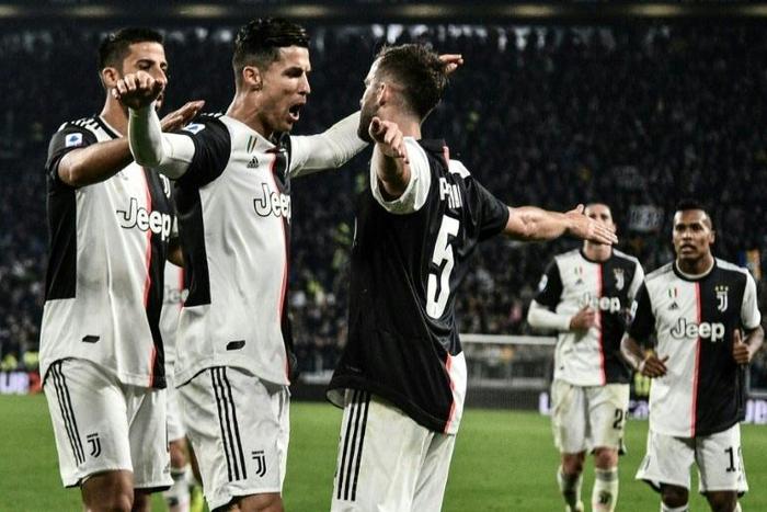 Cristiano Ronaldo and Miralem Pjanic celebrate scoring