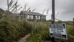 Churning North, Hurricane Drubs Weary Carolinas