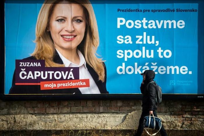 A billboard in Bratislava of frontrunning presidential candidate Zuzana Caputova reads: "Stand up against evil, together we can do it"