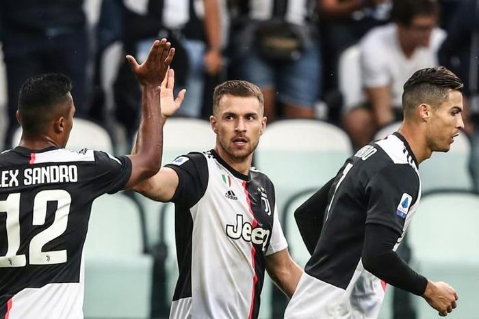Welsh midfielder Aaron Ramsey (C) scored on his first start for Juventus.