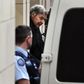 Australian Cardinal George Pell is escorted in handcuffs from the Supreme Court of Victoria in Melbourne on August 21, 2019.