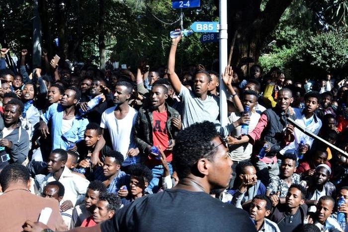 The unrest was triggered when media mogul Jawar Mohammed, an Oromo activist, claimed that security forces had plotted an attack against him. Shown here are supporters at a rally outside his home