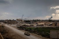 A coalition vehicle drives on Feb. 10 toward the front lines in the battle for Baghuz, the last territory held by ISIS.CreditIvor Prickett for The New York Times