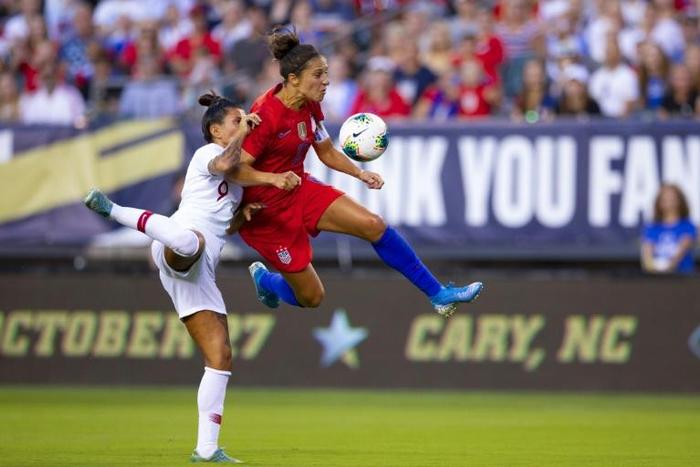 American Carli Lloyd competes for the ball with Portugal's Ana Borges in the first half of the United States' 4-0 friendly win at Lincoln Financial Field