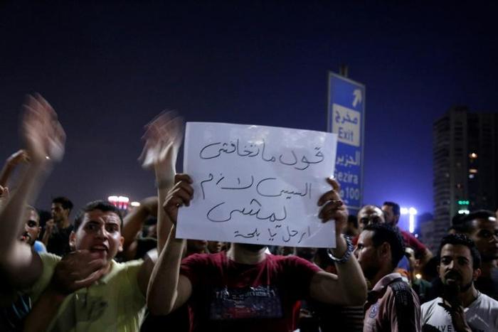 Protesters shout slogans as they take part in a protest calling for the removal of President Abdel Fattah al-Sisi in downtown Cairo on September 20