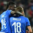 Italy's midfielder Nicolo Barella (C) and Moise Kean (L) scored in either half against Finland
