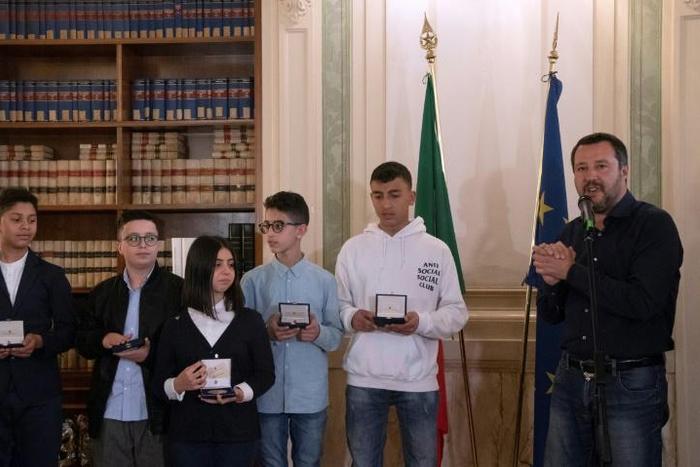 Italian Deputy Premier and Interior Minister Matteo Salvini (R) meets with five children who helped to save other children during the March 20, 2019 Milan bus attack, saying they deserve Italian nationality
