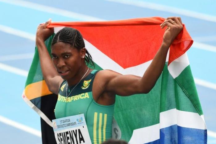 Caster Semenya celebrates with the South African flag after winning the women's 800m during the African Athletics Championships in Nigeria in August 2018