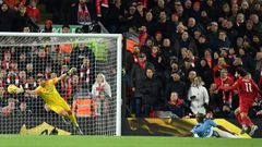 A Mohamed Salah (R) header beats Manchester City goalkeeper Claudio Bravo to give Liverpool a two-goal lead in an English Premier League clash at Anfield