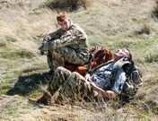 <strong> From left,</strong> Frank Delatour and Alex Haug take a rest while waiting for their running mates near the finish line.