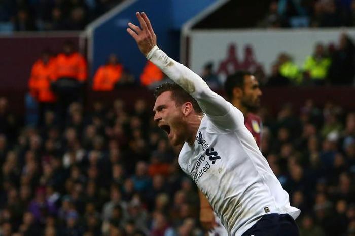 Liverpool defender Andrew Robertson celebrates the equaliser at Aston Villa