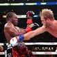 Logan Paul, right, delivers a punch to KSI in their cruiserweight fight Saturday at Los Angeles