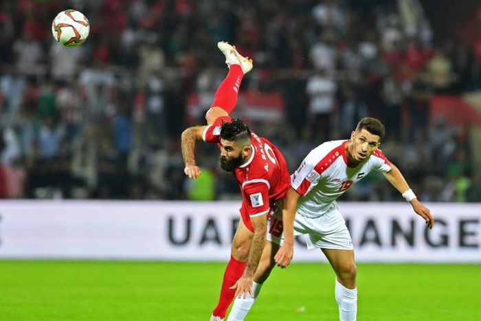 A file photo of Al Masry forward Mahmoud Wadi (R) playing for Palestine against Syria during the 2019 Asian Cup in the United Arab Emirates