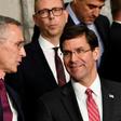 NATO Secretary General Jens Stoltenberg (L) talks with US Defense Secretary Mark Esper (R) during a NATO defence ministers meeting, at the NATO headquarters in Brussels