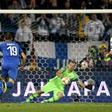 Finland's goalkeeper Lukas Hradecky fails to stop the penalty by Italy's Jorginho (not in picture)