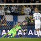 Finland's goalkeeper Lukas Hradecky fails to stop the penalty by Italy's Jorginho (not in picture)