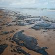 A handout picture released by the Sergipe State Environment Administration on September 25, 2019, shows oil spilled on a beach in Pirambu, Sergipe state, Brazil