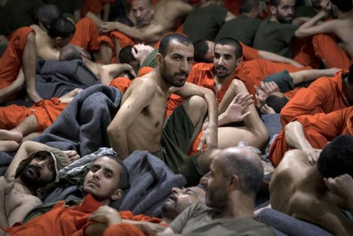 More than 12,000 Islamic State group prisoners are crammed into Kurdish-run detention centres like this one in northeastern Syria, with breakouts an ever-present risk amid a three-week-old Turkish offensive
