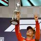 Ferrari's Charles Leclerc holds his trophy aloft after winning the Belgian Formula One Grand