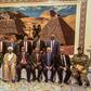 Sudan's President Omar al-Bashir (6th-L, front) poses for a group photo with members of his new 20-member cabinet as they take the oath of office at the presidential palace in Khartoum