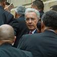 Former Colombian president Alvaro Uribe (C) arrives at the Palace of Justice for a hearing before the Supreme Court in a case over witness tampering