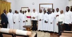 Rawlings with catholic priests