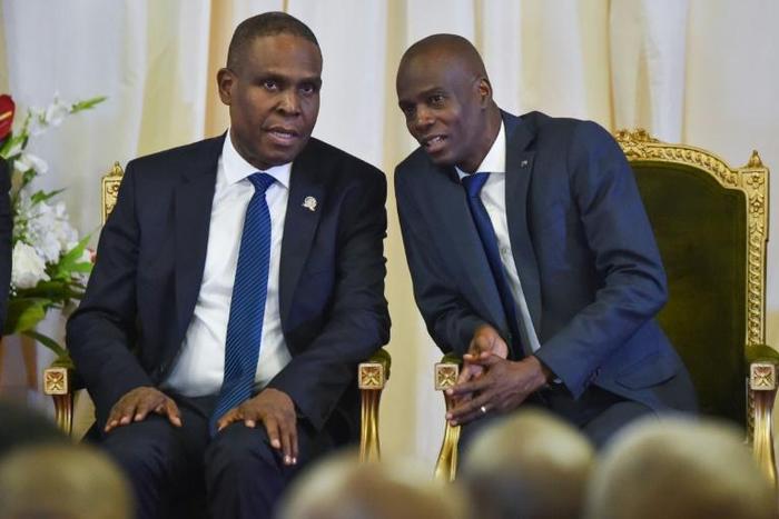Haitian Prime Minister Jean-Henry Ceant (L), seen here speaking with President Jovenel Moise in 2018, has been censured by the lower house of Parliament
