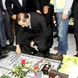 Ali Akbar Velayati, who has been slapped with sanctions by the United States and serves an adviser to Iran's supreme leader Ayatollah Ali Khamenei, prays over the tomb of a Hezbollah fighter at a cemetery in Beirut's southern suburbs in May 2015