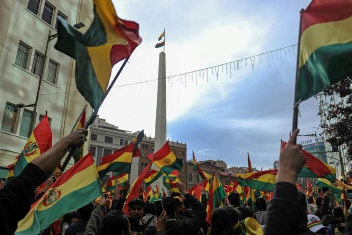 People rally in the streets of Bolivia's capital after their president stood down on November 10, 2019