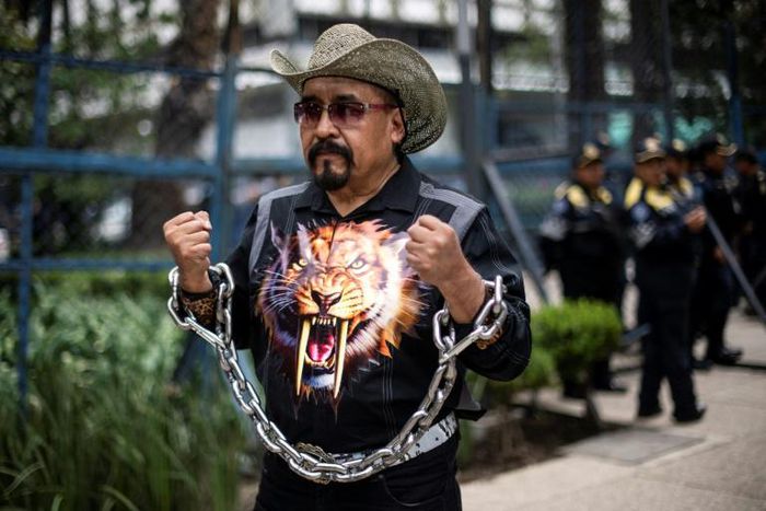 A man takes part in a protest against US immigration policies outside the US embassy in Mexico City in June 2018