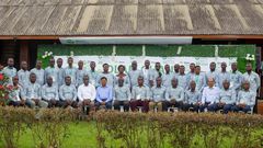 Olam Country Head, Mr. Amit Agrawal (6th from left) and Mr. Eric Botwe (8th from right) join District Cocoa Managers and other Senior Managers after the week-long conference