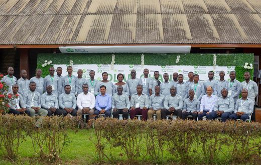 Olam Country Head, Mr. Amit Agrawal (6th from left) and Mr. Eric Botwe (8th from right) join District Cocoa Managers and other Senior Managers after the week-long conference