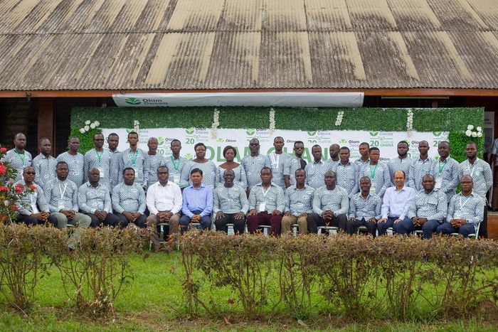 Olam Country Head, Mr. Amit Agrawal (6th from left) and Mr. Eric Botwe (8th from right) join District Cocoa Managers and other Senior Managers after the week-long conference