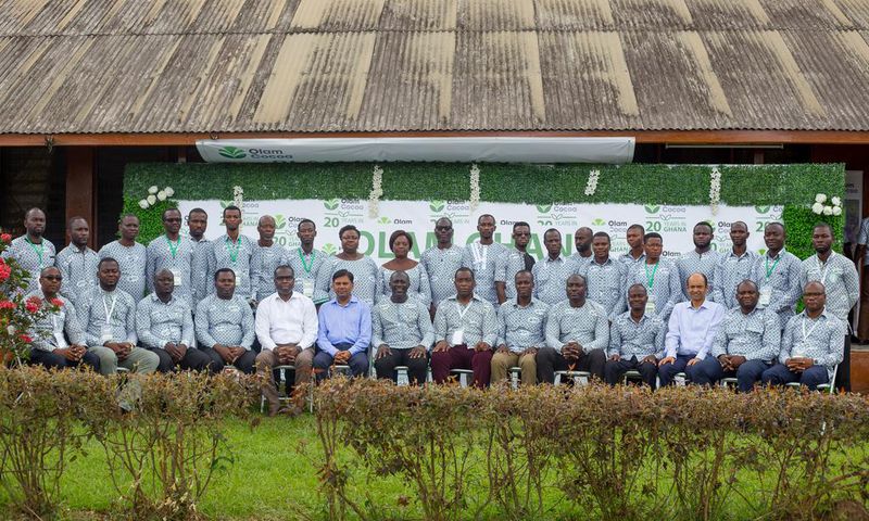 Olam Country Head, Mr. Amit Agrawal (6th from left) and Mr. Eric Botwe (8th from right) join District Cocoa Managers and other Senior Managers after the week-long conference