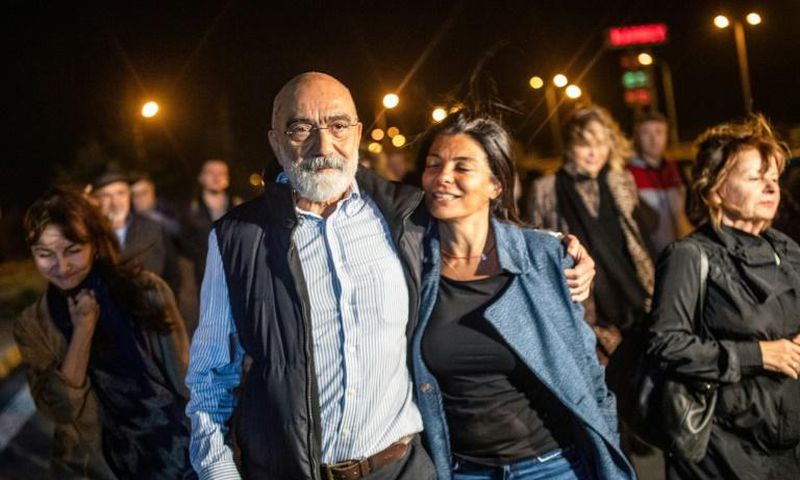 Turkish journalist and writer Ahmet Altan walks with his daughter Sanem Altan after being released from prison