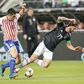 Miguel Layun #19 of Mexico National team battles for control of the ball with Paraguay's Rodrigo Rojas in Mexico's friendly victory over Paraguay in Santa Clara, California