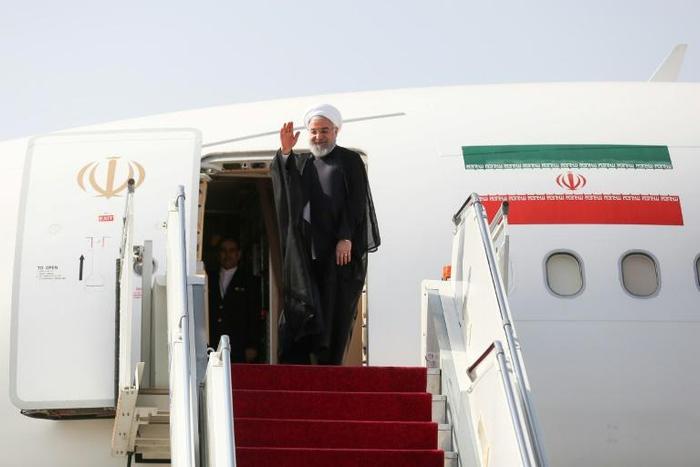 Iran's President Hassan Rouhani spoke to reporters at Mehrabad airport, en-route Monday for the UN General Assembly in New York