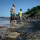 The oil has been seen along Brazil's northeastern Atlantic coast, including Pernambuco state, where volunteers are pictured cleaning up on October 21, 2019