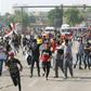 Iraqi security forces use tear gas to disperse the crowds in Baghdad as thousands of protesters massed near the high-security Green Zone in the second phase of a wave of anti-government demos