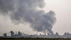 The Turkish military hits Kurdish-controlled towns along the border with air strikes and artillery fire before ground troops cross into Syria