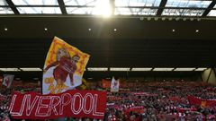 Liverpool fans wave flags at Anfield